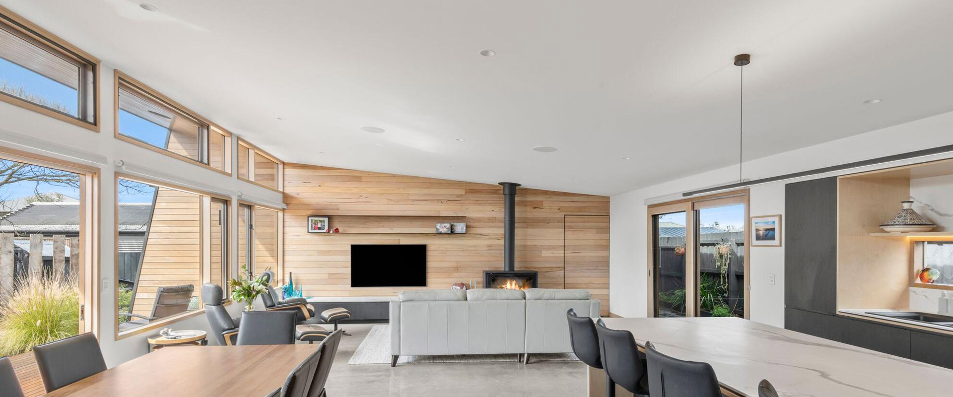 Sustainable Light House Point Lonsdale well lit living room with beautiful timber windows by Pickering Joinery, Geelong