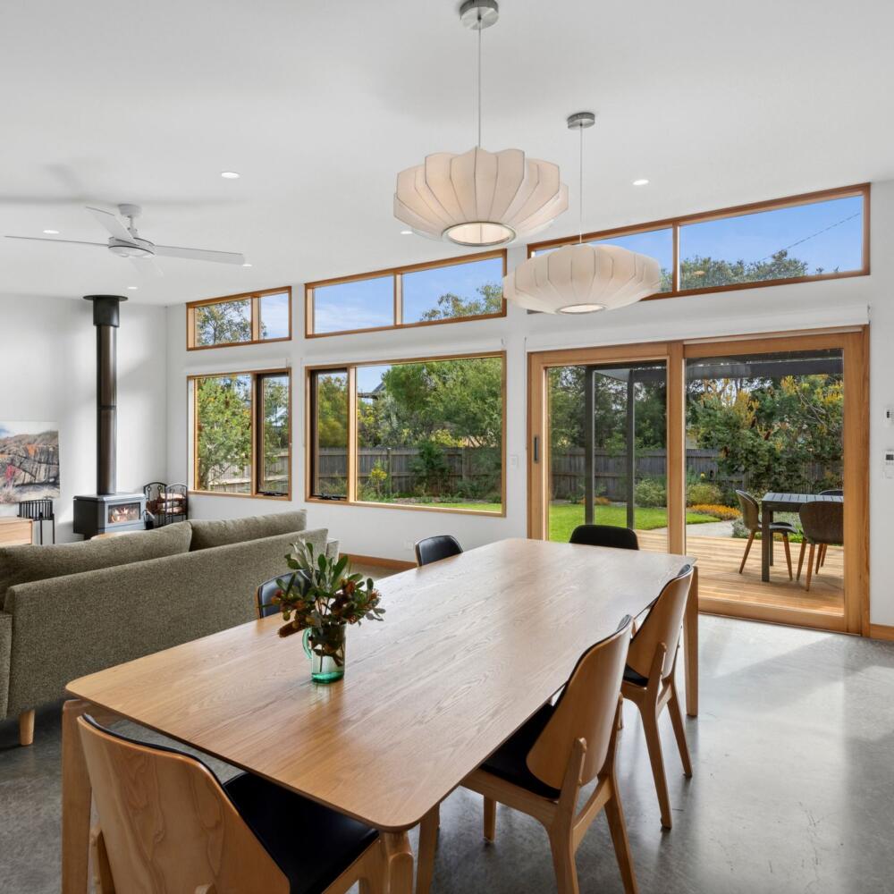 A view of the manicured back yard from the homes open living area.