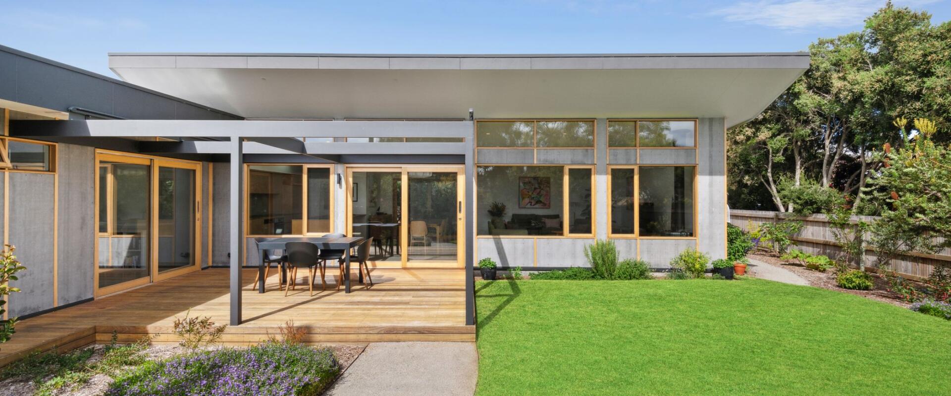 Admiring a beautiful home built with high quality timber windows and doors.