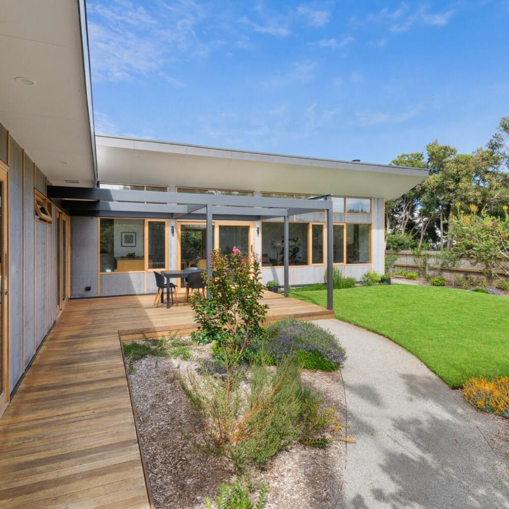 Beautiful native backyard garden featuring Pickering Joinery timber windows and large sliding doors